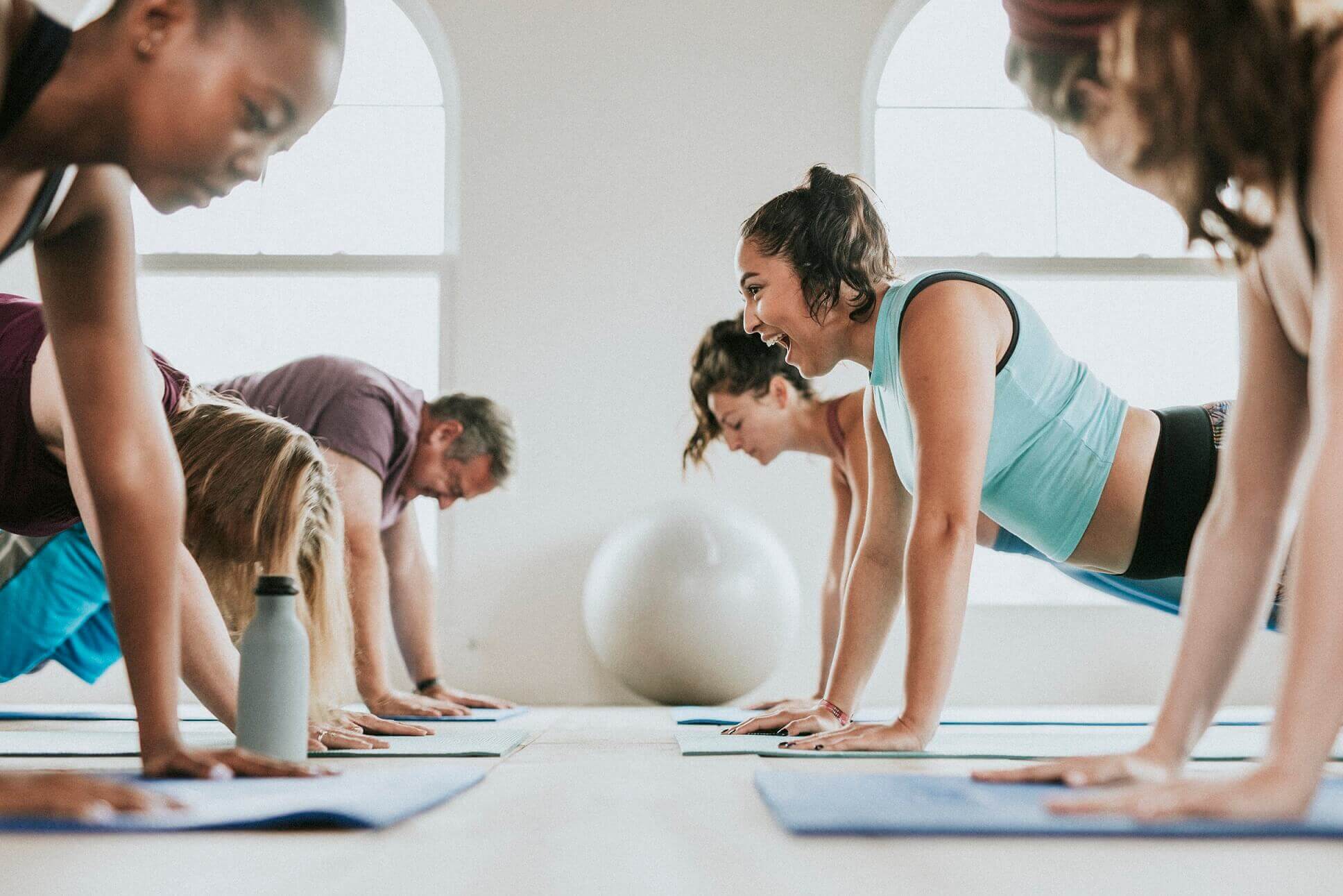 group-of-people-doing-full-plank-pose-G46DZHZ.jpg