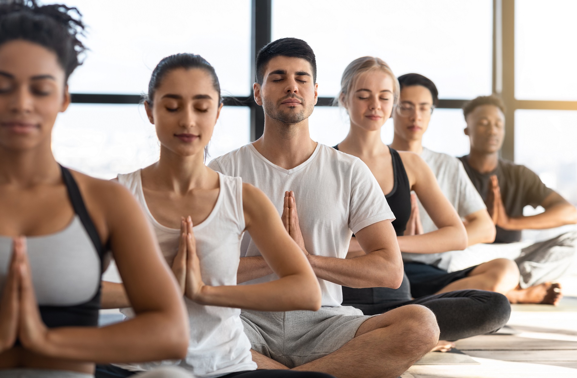 zen-multiethnic-group-of-relaxed-people-meditating-Q77V7AN.jpg